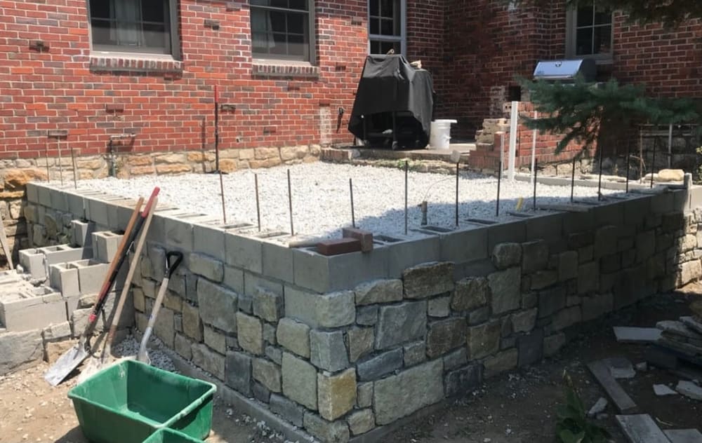 Rebuilt stone-and-block foundation wall
