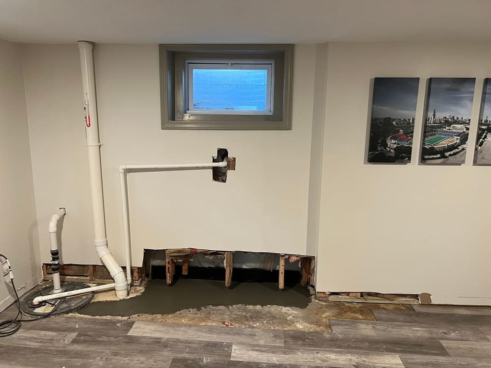 Finished basement bedroom with a code-compliant egress window and well