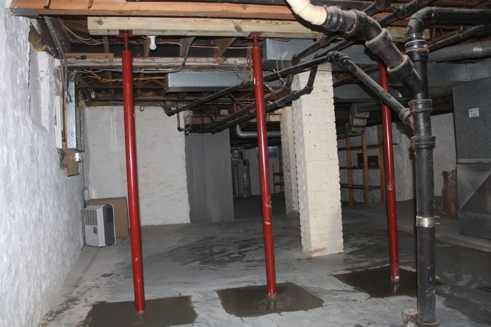 Basement foundation wall braced with steel I-beams